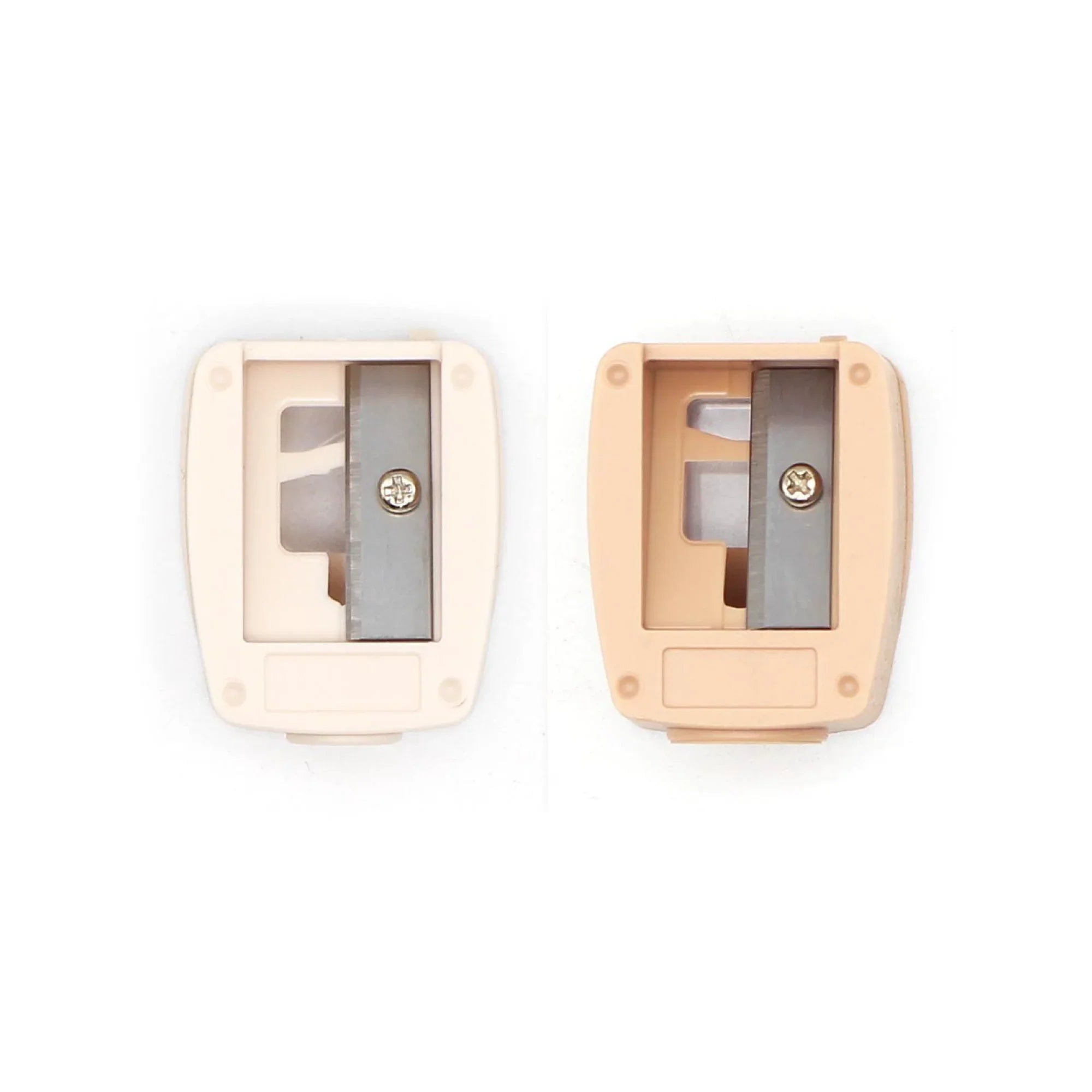 Two pencil sharpeners, one beige and one white, on a white background