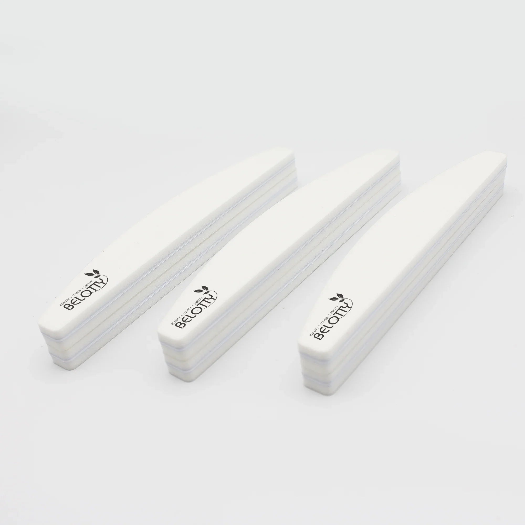 Three white Belotty Sanding Sponge on a light gray background